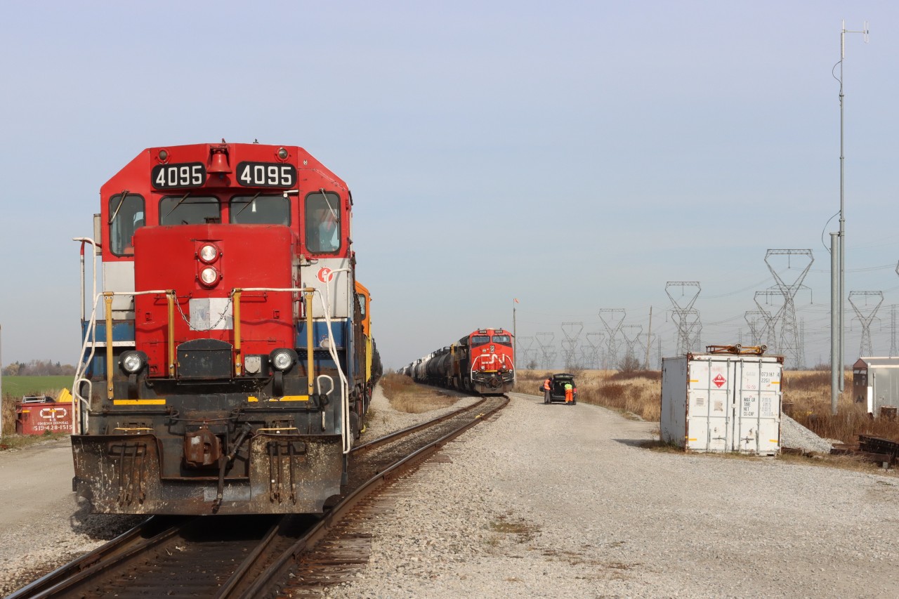 While the crew on SOR 591 (RLK 4095 QGRY 2301) builds their train on the lead, the crew on CN L502 (CN 3225 CN 3940) load their bags into the cab, then will head to the north end of the yard, restore the derail and will be off to take their rest.
