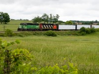 The Green Goblin frenzy has ended...
CN 580 (and 581) might have been the most popular train all summer, with BNSF 2098 headlining the set and the likes of CN 9547, 4713, and 4791 acting as supporting characters. But of course, in early June when it first arrived, we didn't know it would last that long. On one of its first trips along the Hagersville sub, BNSF 2098 & CN 9547 cut through the rolling hills north of Onondaga ON with 11 loads from CGC. 