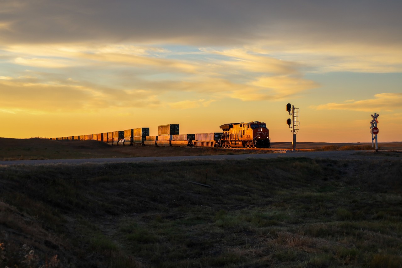 Q 11791 23 blasts through Oban, as the sun rises over the Saskatchewan prairies.