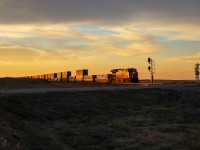 Q 11791 23 blasts through Oban, as the sun rises over the Saskatchewan prairies.