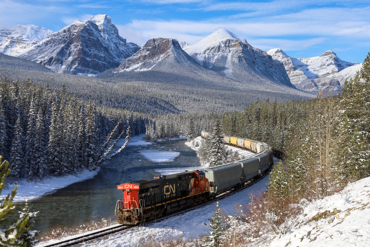 CN 3852 shoves CPKC 301 through Morant’s Curve, as they work upgrade toward the continental divide.
