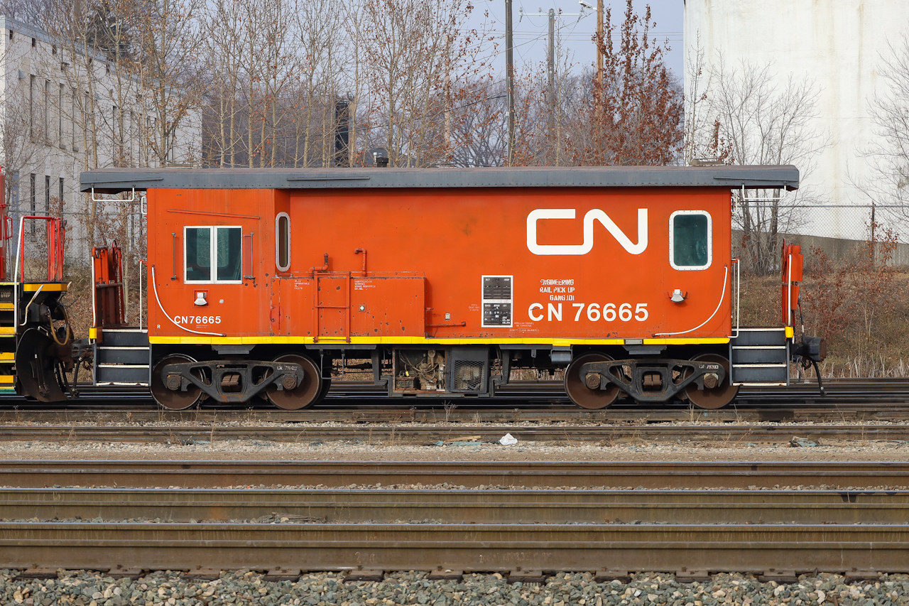 CN 76665, a transfer van now assigned to the MOW department in Symington Yard, sits in Edmonton Alberta coupled to a pair of Dash 8's