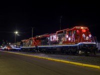 The 2023 edition of CN’s Christmas Express, is seen here at Edmonton Walker Yard preparing for a trip to St. Albert.  In what could be their last assignment, CN 2107 and CN 2112 are decked out in Christmas Lights with 4 Rocky Mountaineer coaches and a CN Transfer van on the tailend. 