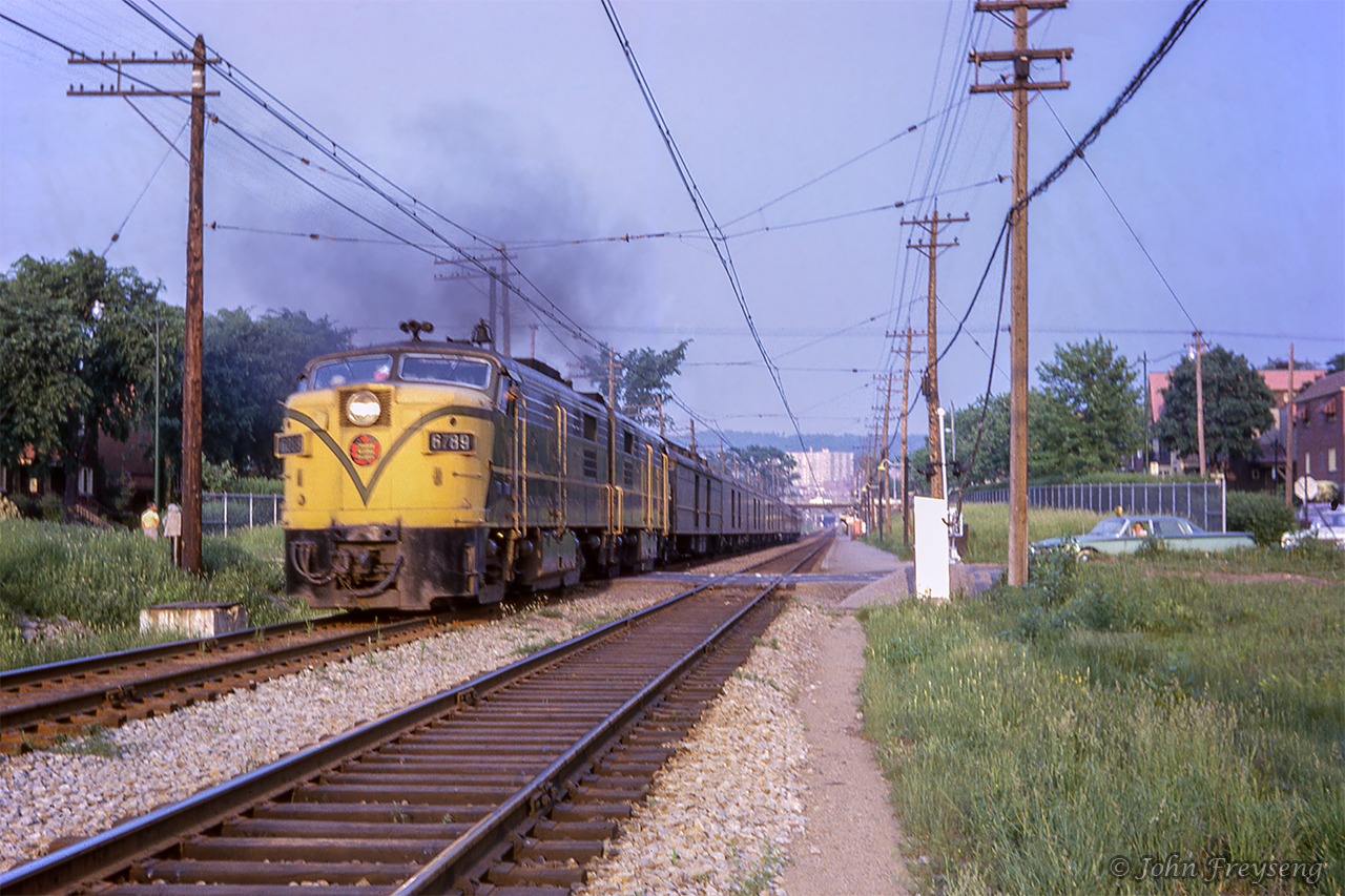 Montreal - Hervey train 114 is seen passing Mont Royal station approaching E.J. Tower, where it will swing east onto the St-Laurent Sub.Scan and editing by Jacob Patterson.