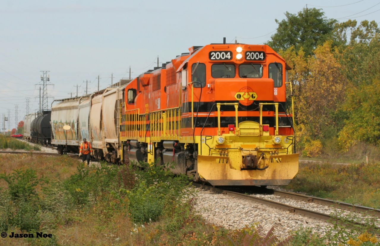 During a fall afternoon, Goderich-Exeter Railway #582 has just come off the North Spur in Guelph, Ontario on the Guelph Junction Railway with QGRY 2004 and GEXR 2073.