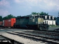 A CP westbound powered by Quebec, North Shore & Labrador Railway SD40 206 arrives in Galt in July 1984. This unit later became CP 5402 after being acquired by CP Rail. 
<br>
See the link for a William D. Miller photo of the same train on the same day. 
<br>
http://www.trainweb.org/galt-stn/cproster/locomotive/5400s/cp5402%20as%20qnsl206.htm
