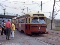 An MU consist on the Queen streetcar route pulls into Humber Loop, after coming off the private <a href=http://www.railpictures.ca/?attachment_id=51010><b>Queensway streetcar right-of-way</b></a> and ducking under The Queensway. TTC PCC's 4434 and 4490 (both A7-class cars built by CC&F in 1949) stop for waiting passengers to board. After the busy Bloor and Danforth streetcar lines (that often ran with MU'ed PCC cars) were replaced by the new subway line, the 4400's (and 4600-series secondhand cars) were two groups that retained their couplers for MU operations, and served along the busy Queen Street route.
<br><br>
<i>Dennis Cowley photo, Dan Dell'Unto collection slide.</i>