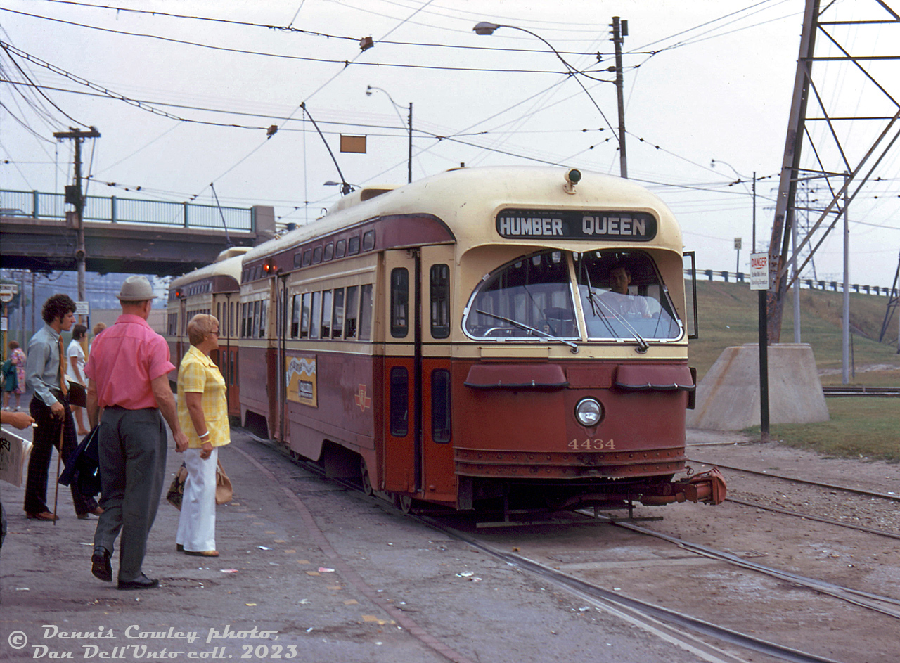 An MU consist on the Queen streetcar route pulls into Humber Loop, after coming off the private Queensway streetcar right-of-way and ducking under The Queensway. TTC PCC's 4434 and 4490 (both A7-class cars built by CC&F in 1949) stop for waiting passengers to board. After the busy Bloor and Danforth streetcar lines (that often ran with MU'ed PCC cars) were replaced by the new subway line, the 4400's (and 4600-series secondhand cars) were two groups that retained their couplers for MU operations, and served along the busy Queen Street route.

Dennis Cowley photo, Dan Dell'Unto collection slide.