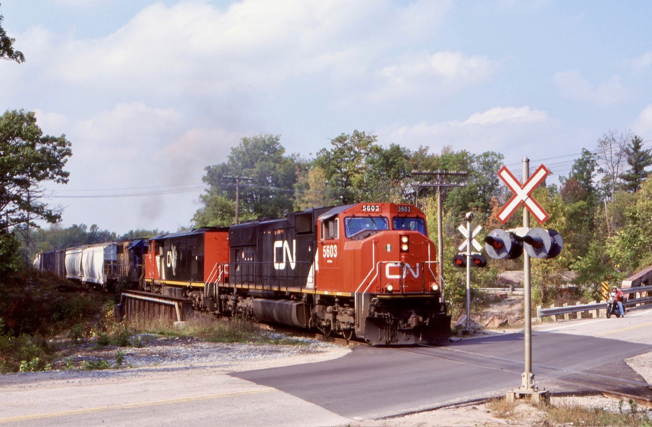 I always enjoyed spending time at the Rama Rd. Crossing in the south end of Washago. It’s hard to believe it has been over twenty years since I’ve taken a shot there. Today the old road bridge has been replaced and gates now guard the crossing, not to mention the lack of more interesting motive power. Nevertheless I’ll have to head to Washago again hopefully in the not so distant future. This day CN 450 had only cleared the New Market subdivision a few miles back and was now in its last leg of its trip to Toronto. Back then borrowed ONR power was common on trains 450/451 but not so much today.