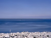 Perhaps one of the most boring railway photos I have taken, this is a view from the BC Ferries road causeway at Tsawwassen northwestward to the rail-and-road causeway to the Westshore Terminals export coal terminal at Roberts Bank, and is notable for being in the early years (1972-05-30, so 25 months to the day) of operation there, and for showing an entire CP coal train with two MLW M-630s leading, then 39 cars plus two units with a robot car, then 49 more cars and a caboose, all stretched out on the single track after exiting the dumper loop.  Amazing for the time, 88 cars in one train!  This is from the second roll of Kodachrome in my two-weeks-old Pentax Spotmatic camera, another amazing advance at that time.

<p>In those early years, the entire causeway was off limits to railfans and the general public, with a gatehouse at the east (shore) end, so the specific equipment identity is unknown.