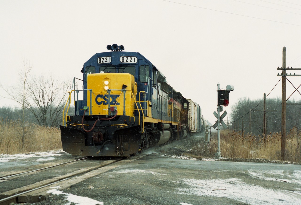 Another shot of a train I offered up before, a few years ago; but something decent is worth more than one passing image, is it not?  This is CSX 8221 and 6218 passing the old "Stop, Look and Listen" crossing sign at Crowland and Biggar Rd as the train heads closer to the US border.
