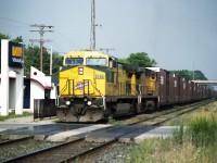 Back in the days of #327 and #328, the NS autoparts trains, rumbling back and forth down the Grimsby Sub as part of their journey between Talbotville, ON and Buffalo, NY, I saw a heck of a lot of variety.  These trains used to run with almost anything, it appeared. Mostly combinations of NS and CP power, but there were some exceptions.  This day, the last of June 2005, saw my favourite leader.  One of the last two original C&NW units of this road that had been taken over by UP is heading up this train by Grimsby's little kiosk station. The 8646 and its only other still unlettered to UP rep, #8701, were not repainted until 2018. I don't know where they are now, but presumably stored someplace on the UP system.
Power seen in this shot has UP 9621 following the classic C&NW.