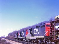 A sunny spring day. A "going away shot" Train 407 with CN 4575-4586-4520 westbound on the Dundas Hill. I'm thinking the location was near mile 3 point 5 and I was east of the Sydenham Road overpass. I had forgotten about the signal bridge until I scanned this slide. Kodak Instamatic Memories from long ago.