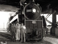 After one of the last regularly scheduled steam services to Niagara Falls, CN 6060 and her crew pause before the locomotive is returned to the Spadina roundhouse.