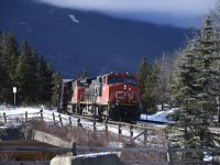 <b> CN mixed freight </b> <br>
CN 2690 & CN 3072 leading a mixed freight consist sit a few hundred feet east of CN Home Mile 0.55 Albreda Sub waiting for clearance into the yard at Jasper, AB. <br>
This photo was taken at the Hazel Avenue road crossing Mile 0.29 CN Albreda Sub. at the west end of Jasper yard where I spent numerous hours during each of my three days in town. There was a continuous string of east and westbound train traffic in and out of Jasper that could be easily viewed from this location. <br>
The Hazel street crossing is at the west end entrance to the CN yard and crew hostel and provided some nice views of the yard, the town, and the mountains while I waited for train movements. <br>
Two of the three days were sunny and blue, but all three were bitterly cold. Fortunately, it was only a stones throw to a variety of bake shops, coffee shops, and restaurants where a pastry and hot chocolate could be had! :-)
