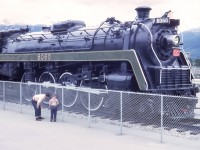 The date stamp on the Kodachrome reads Jul 62. Mr. Homes will only have just set the 6060 up on it's viewing platform in Jasper. It will be another 10 years before the 6060 is freed to the rails and allowed to roam them once more. A couple of master mechanics are checking out the running gear :^), from our summer of 62 vacation.