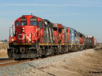 CN L568 is just west of Baden, Ontario on the Guelph Subdivision approaching Nafziger Road with a short train. The consist includes; 4125, 4726, GTW 5849 and 7515. 