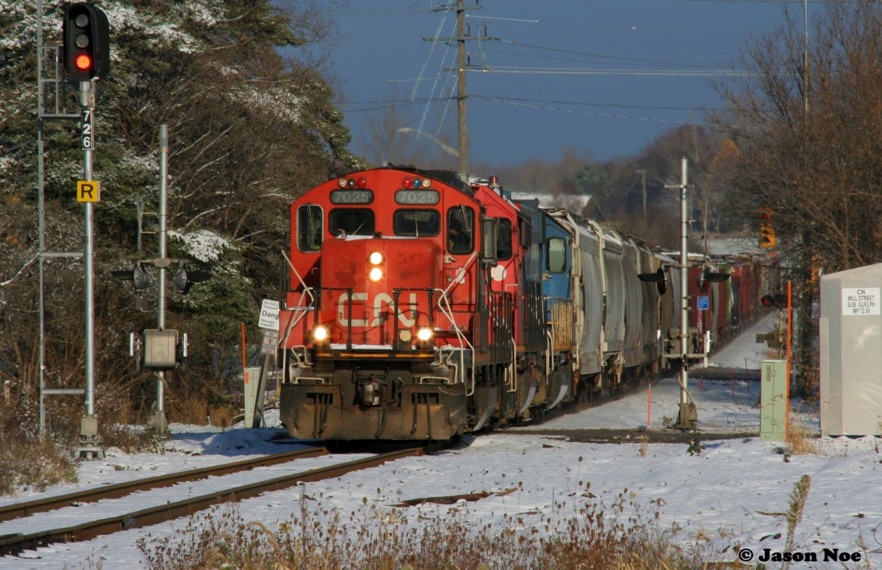 CN L568 with 7025, 7515 and GTW 5849 are viwed heading through the town of Baden, Ontario on the CN Guelph Subdivision westbound to Stratford, Ontario after a recent snow fall.