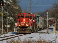 CN L568 with 7025, 7515 and GTW 5849 are viwed heading through the town of Baden, Ontario on the CN Guelph Subdivision westbound to Stratford, Ontario after a recent snow fall. 