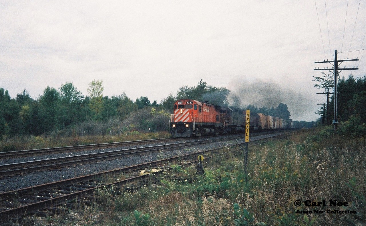 A short CP eastbound (likely 270) heads through Blandford, Ontario on the Galt Subdivision with 15 cars. The train is powered by CP C424 4237, SOO SD40A 6408 and SOO SD40-2 6602.