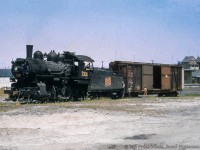 CNR O-15-b, 0-6-0 7308 is seen working along Kitchener's St. Leger Street Spur, switching the property at 150 St. Leger, the site presently occupied by Canada Post.  In the background, beyond the boxcar, the house at 60 Edwin Street can be seen, as well as two houses above at 16 and 20 Hill Street.<br><br><i>Bill Price Photo, Jacob Patterson Collection Slide.</i>