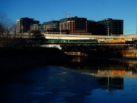 VIA 33 has the last Renaissance consist remaining in corridor service as it passes the semi-frozen Peel Basin on its way to Central Station. A second Renaissance consist had been in use until it was replaced by a Siemens consist a few weeks back.