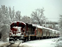 Thick snow continues to fall as CN 4139 & CN 4795 shove grain empties from Track PC-27 back to Pointe St-Charles Yard.