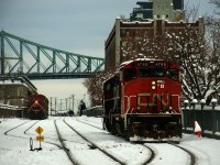 CN and CPKC light power are about to meet in the Port of Montreal as CN 500 back up to its outbound cars.