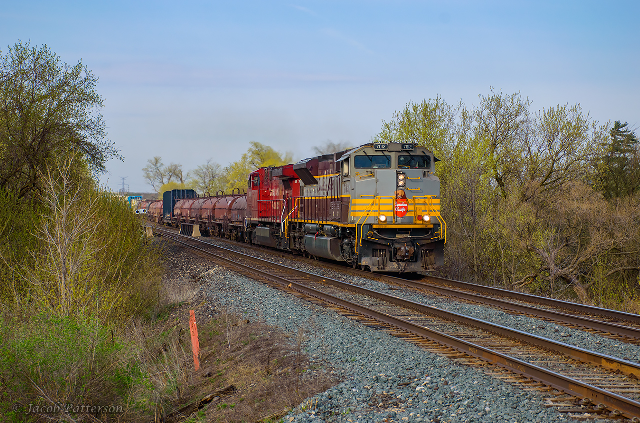A few days into the CPKC era, CP heritage-painted 7012 leads 236 west after working Hornby.
