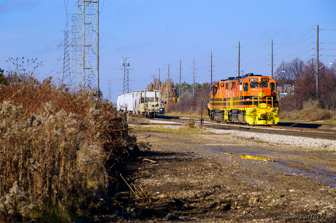 GEXR 582 makes one last move to finish their work in the north end before starting their trip back to Guelph Junction.   They are seen backing down recently extended siding XT99.