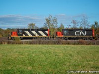 Caught L 56231 14 with CN GP9RM 4140 and CN GP9RM 7071 on the Humberstone Spur at Yager heading westbound back to Port Robinson from Port Colborne on Oct 14, 2013.