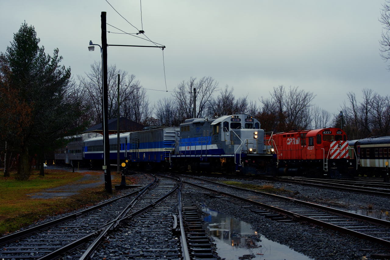 Exporail's first Christmas Train run of the year departs Hays Station amidst light rain/flurries. The white class lights are lit on GP9 AMT 1311 as it passes C-424 CP 4237.