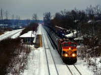 KCS 4603 leads ethanol train CPKC 528 past Cedar Park Station.