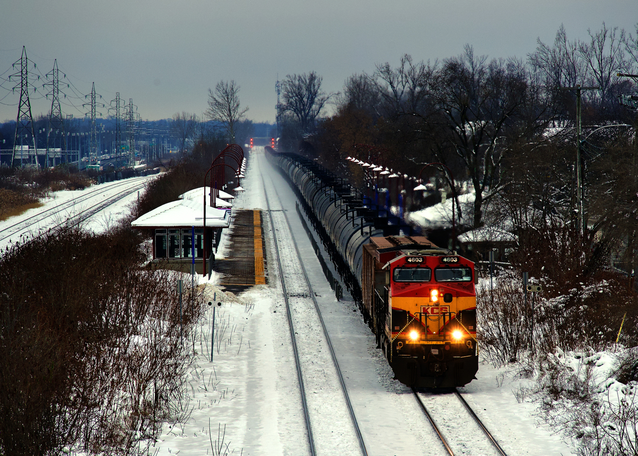 KCS 4603 leads ethanol train CPKC 528 past Cedar Park Station.