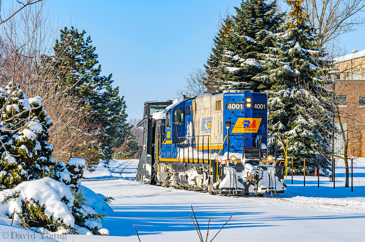 Returning from their morning run along the Goderich, the crew of X518 waits just short distance from the switch to enter the Guelph Sub at Cowie. After waiting for VIA 85 to complete their station stop and continue west, they will pull up to the station to get their orders to continue their day- plowing the Guelph Sub west towards St. Mary's and London. A memorable day that was almost 15 years ago... sheeesh. 

More from that day.
Arrival at Goderich. 
Fueling at Clinton. 
Waiting at Stratford.