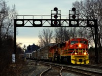 QG 502 with a repainted ex-BNSF SD70MAC leading heads north on CPKC's Adirondack Sub after leaving St-Luc Yard. It was repainted at the NECR shops in St. Albans, Vermont. Full lashup: QGRY 4018, QGRY 4019 & QGRY 3537.