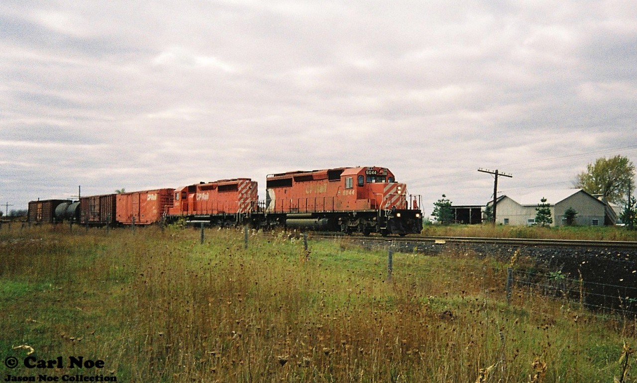 During a fall afternoon, CP SD40-2 6044 and SD40 5541 lead an eastbound through Orrs Lake on the Galt Subdivision.