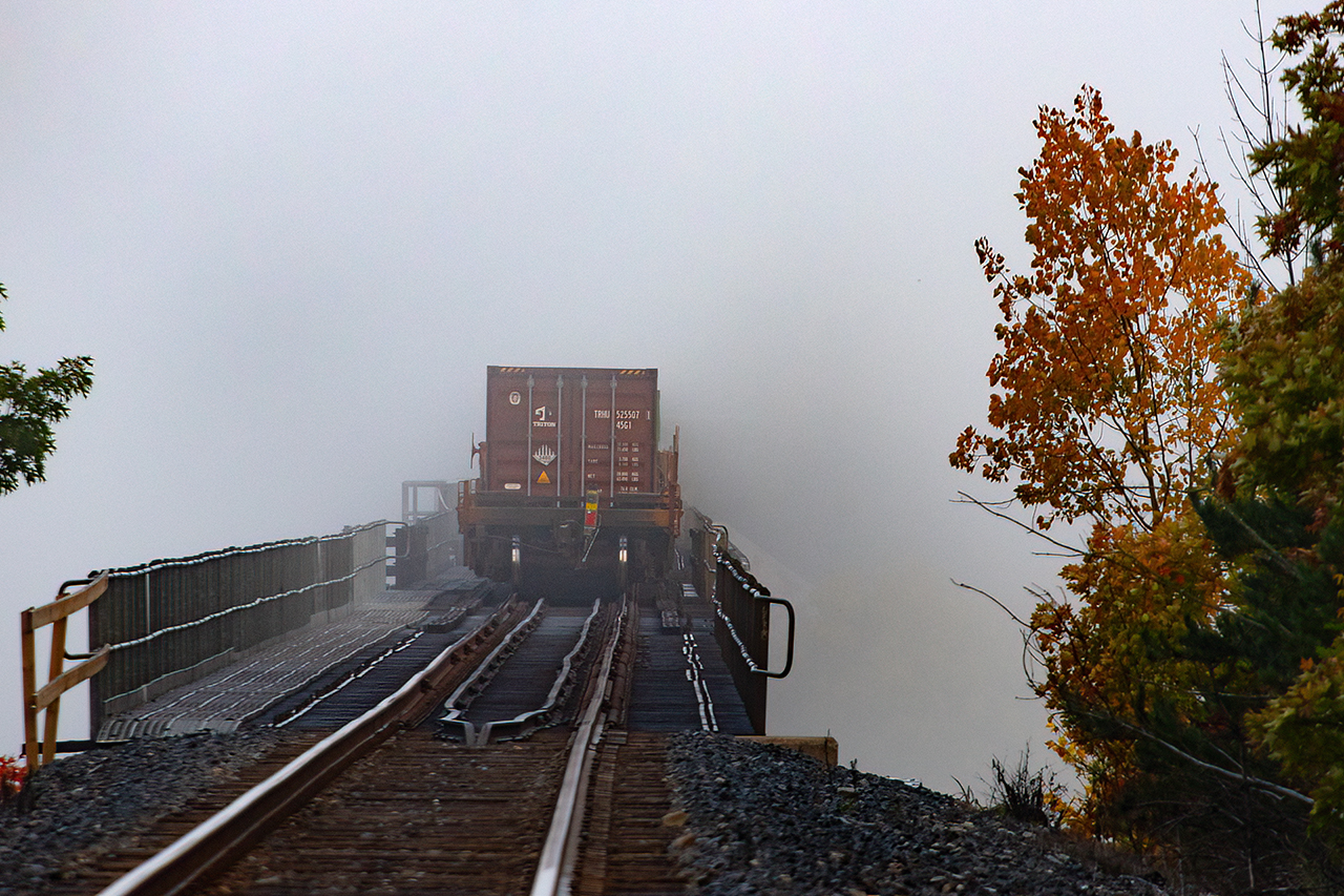 Into the murk....will it ever be seen again? A 100 series CN monster crosses the Seguin River trestle on a very foggy morning.