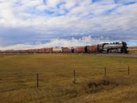 After a rainy morning in Calgary, the sun breaks through the clouds as CP 2816 North highballs through Crossfield. 