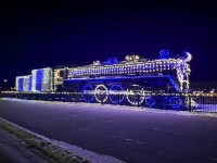 CN 6015 is decked out in Christmas lights, adding to the charm of a quiet winter evening in Jasper, Alberta. 