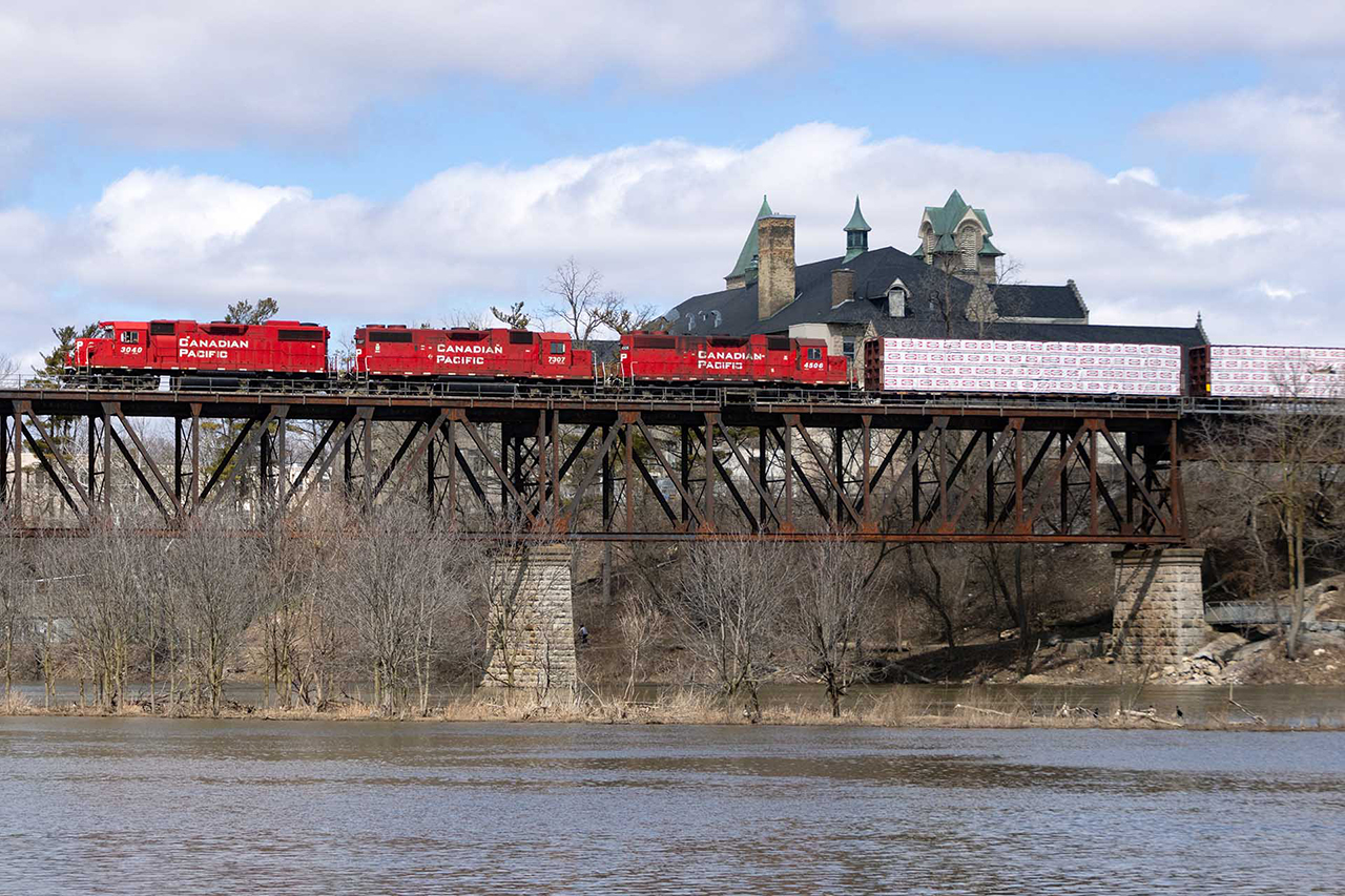 Twice a day, 3 GP38s and associated variants make the run from Wolverton (Ayr) to service Toyota on the northwest side of Cambridge. They come with empties and leave with loads. Here, they're about to chase the just past 137 up Orrs Lake Hill likely with loads 137 will then lift for Chicago.