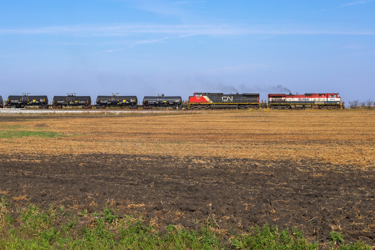 L 51151 16 with BCOL 4642 and CN 2661, pulls out of Scotford Yard enroute to spot Heartland Sulphur.