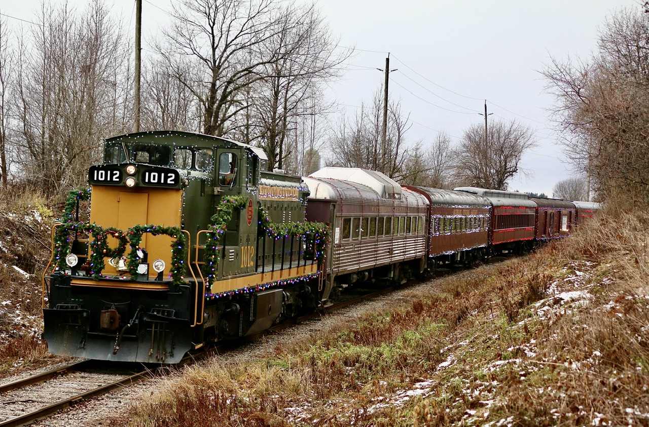It’s hard to believe it’s already that time of year again, but always nice to get out and see any decorated holiday trains. The plan was originally to visit the Aberfoyle & St. Jacobs model train layout that is sadly being dismantled in a couple of weeks, then catch Waterloo Central’s Santa train at 2:30. Unfortunately we were too late to visit the layout but at least caught the Santa train.  Even under miserable lighting conditions a nicely restored GMD1 is a beautiful sight. I have cross paths with GMD1 1012 many times in the past as number 1437 and it is nice to have one of these old veterans beautifully restored not so far away.