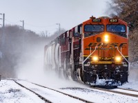 238 is usually 2 units. So on this day, it was either particularly heavy, or one unit had dynamic brake issues, and CP grabbed whatever was available. In this case, to a foamers delight, it happened to be a BNSF GE; probably off a 734 that did the honours. Kicking up a little bit of what has been very rare snow his fall, 238 heads for Buffalo passing what's left of the Killean Siding.   