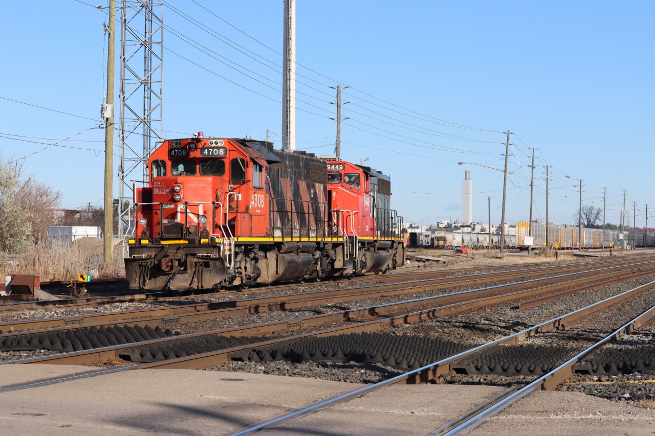 Time for lunch. The Oakville Yard crew is operating in Remote Control Mode with CN 4708 and CN 9449 as they head toward the shop lead having set over a block of tri's deep into the yard.