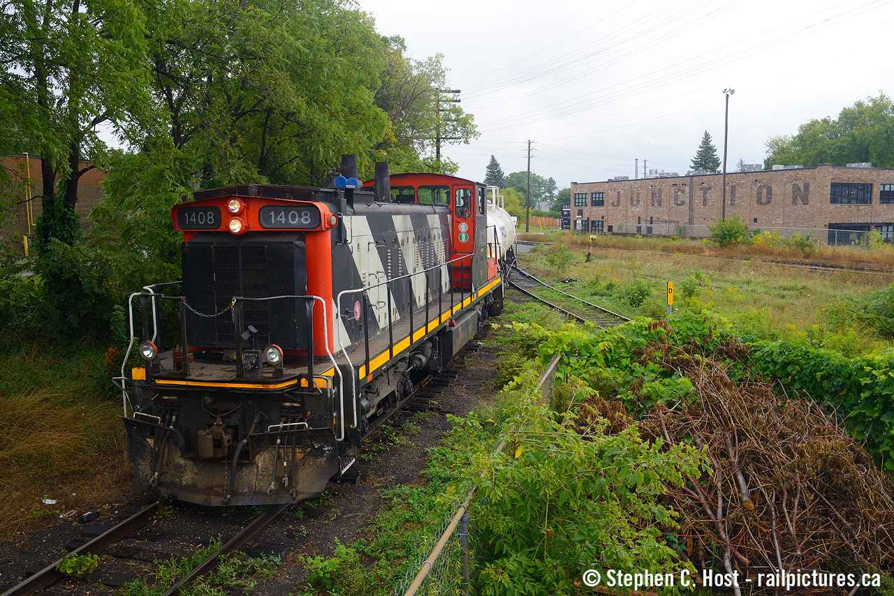 At CN Guelph Junction (Known in the system as Guelph Junction Wellington) Granite Homes created a development from the former CN Freight Shed. Now known as the "Junction" it's a nod to the railway history of the past. It's a great place to visit with nice light views of the Guelph sub, the spurs nearby, and plenty of parking along with railway themed things scattered throughout the property - including a Caboose which serves as an office they rent out. The lettering on the side of the former freight shed building is a nice touch. From the north end, we see L542 going around the wye as they work Guelph with a now retired and sold GMD-1 long hood forward.