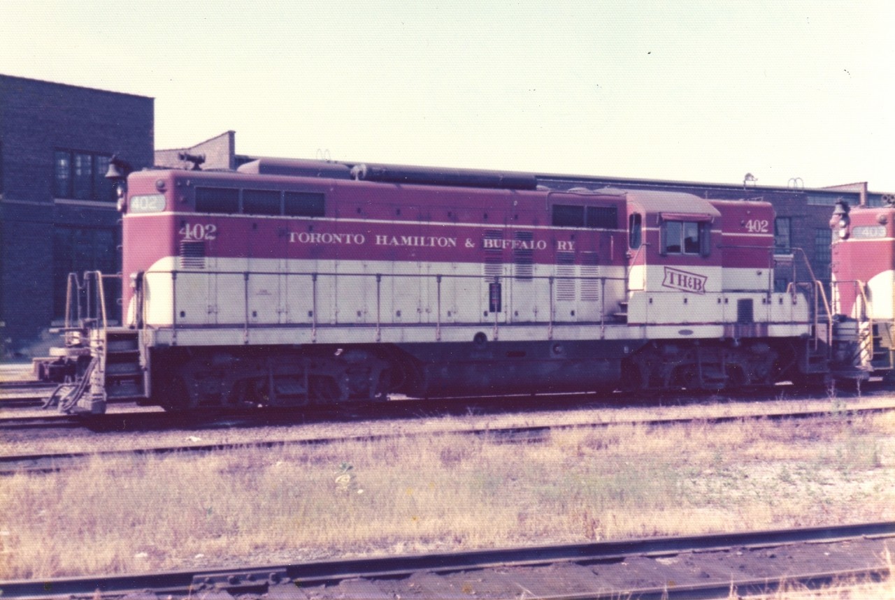 Long hood forward  
TH&B 402 sits idling at the Chatham Street engine facility in Hamilton, ON July 12, 1975.