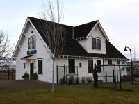 <b> George Little House </b> <br>
Is also known as the Terrace, BC VIA Rail station. <br>
The clouds are below the peaks to the left of the frame while the sun is desperately trying to break out and shine on the mountain tops at the right. <br>
The back of the house faces the CN mainline at Mile 0.0 of the CN Skeena Sub., and Mile 131.9 of the CN Bulkley Sub. The building is shared with the local tourism office. <b> https://www.georgelittlehouse.com/ </b>