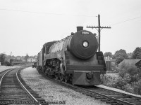 CPR train 640 from Goderich is seen paused at Guelph behind F1a Jubilee 2925 during the summer of 1954.  Less than a year remained for this train, and <a href=https://www.railpictures.ca/?attachment_id=51617>its counterpart, train 637,</a> which made their last runs on April 23, 1955.  In the background, boxcars can be seen spotted <a href=https://drive.google.com/file/d/1vwAVKobCexqyKbv6YYqpVbzJmv2N5dGM/view?usp=sharing>along Cardigan Street</a> near the Pratt Food Company building (formely Goldie Mill).  Silos for the Kloepfer Coal Company can be seen above the boxcars.<br><br><i>Original Photographer Unknown, Jacob Patterson Collection Negative.</i>