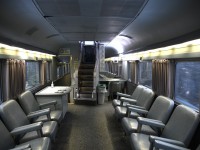 <b> The opposite view </b> <br>
Further to my trip last month, and posting showing the dated furnishings in VIA 8707 Kokanee Park on VIA 005 The Skeena, here is a view in the same car looking towards the staircase to the dome level. <br>
As in the original CP Canadian Park cars, there are six clocks for Canada's time zones (none of them accurate), a stationary desk for writing a post card, and the hallway leading to the Mural Lounge. <br>
What a great car to travel in! :-)